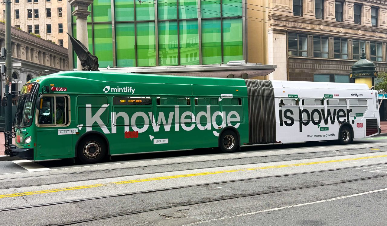 LinkedIn post image: We wrapped a few buses in San Francisco with Mintlify colors.
