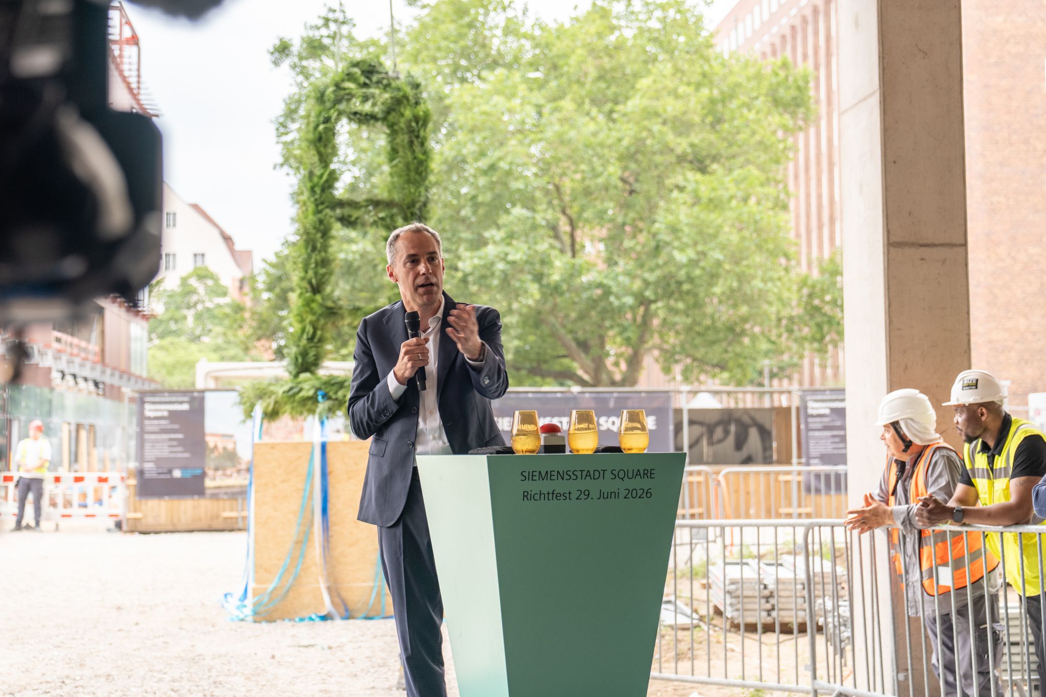 LinkedIn post image: Today we celebrated the topping out ceremony for Siemensstadt Square in Berlin. A tradition we call ‘Richtfest’ in Germa